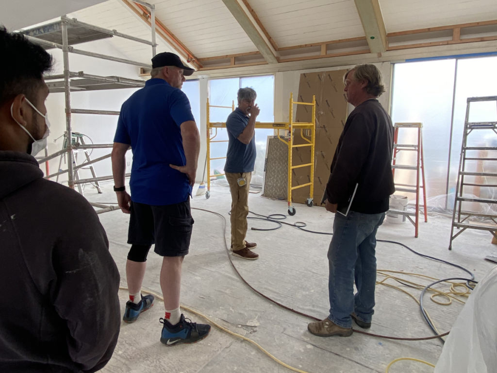 Our construction team on site, linking to the About Us page